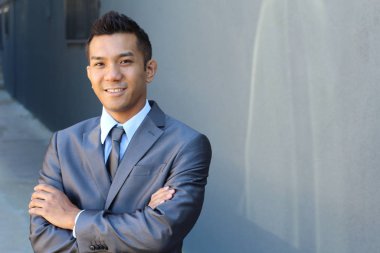 Portrait of a confident Asian lawyer outside