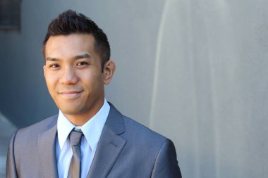 Portrait of a confident Asian lawyer outside