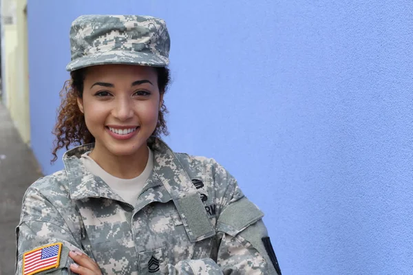 Military girl on blue background with copy space