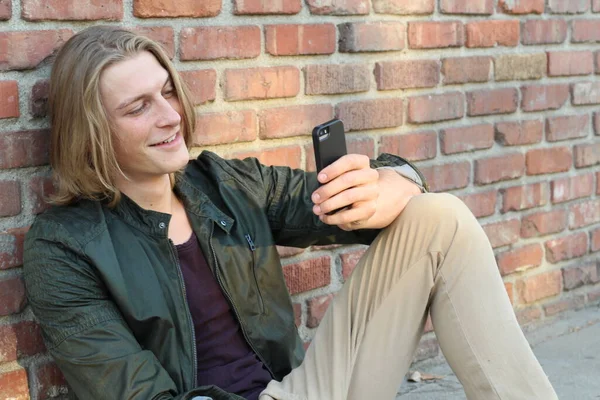 Close Portrait Handsome Young Stylish Man Long Hair Using Smartphone — 스톡 사진