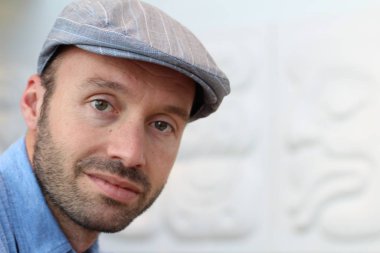 Closeup of handsome man with hipster look in the city