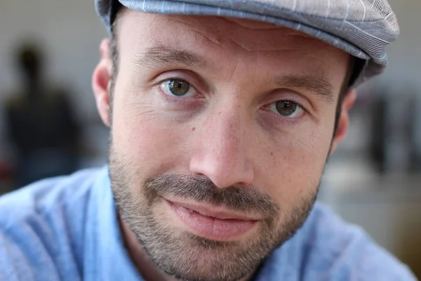 Closeup of handsome man with hipster look in the city