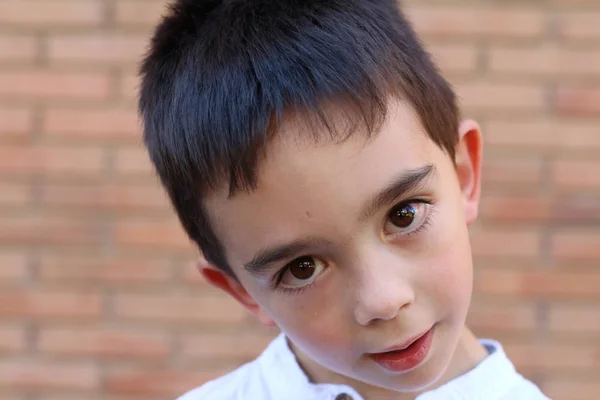 Closeup Portrait Cute Little Boy Standing Brick Wall Background — 스톡 사진