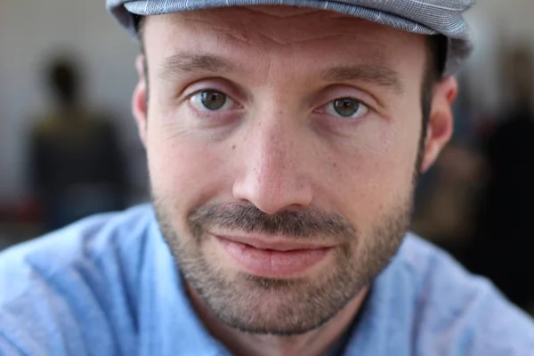 Closeup of handsome man with hipster look in the city