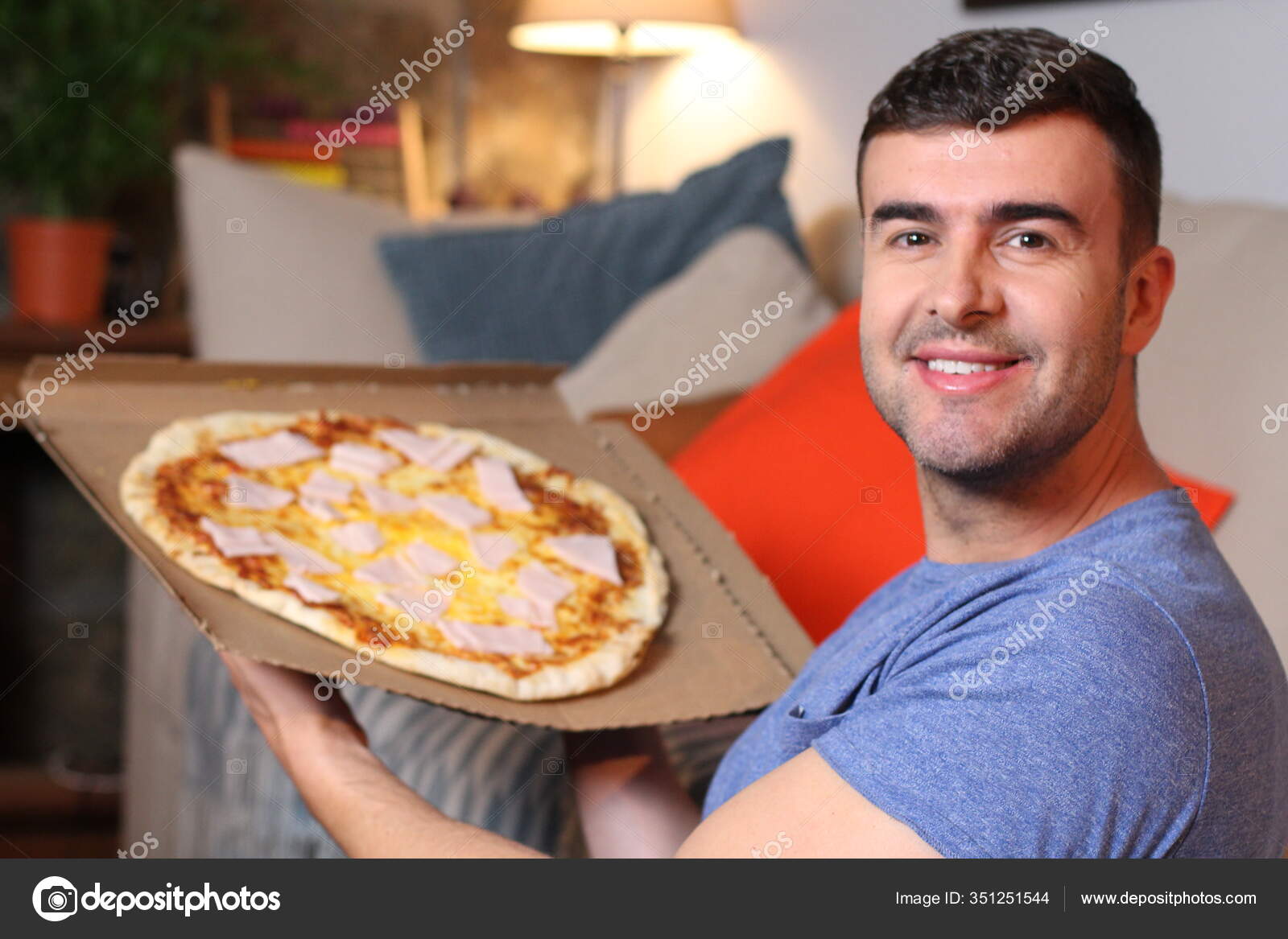 Cheerful Young Man Holding Pizza Stock Photo by ©albejor2002hotmail