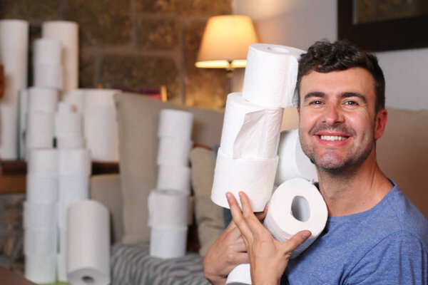 Man stocking up toilet paper at home