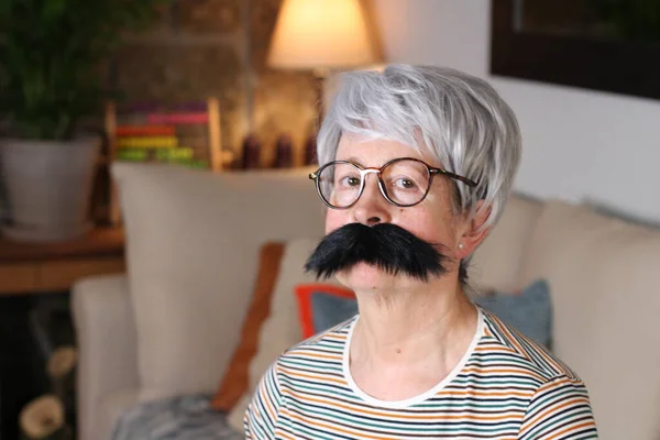 Close Portrait Mature Woman Fake Big Mustache Sitting Home Quarantine — Stock Photo, Image