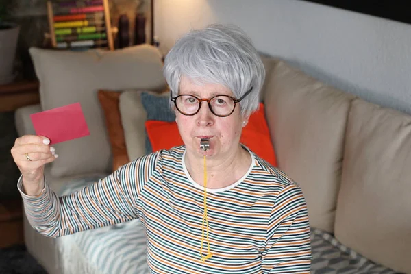 Senior Woman Blowing Whistle — Stock fotografie
