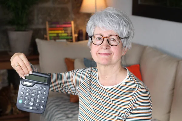 Worried Senior Woman Holding Calculator — Stock Photo, Image