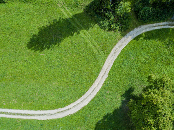 Aerial view of path trough forest in Switzerland