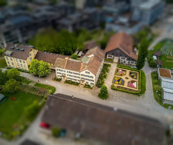 Aerial view of buildings with romantic garden