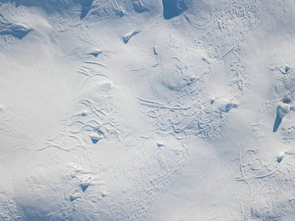 Aerial view of snow covered mountain peak in swiss alps