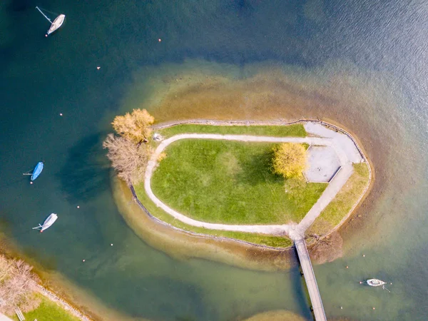 Aerial view of small island near coast on a lake in Switzerland