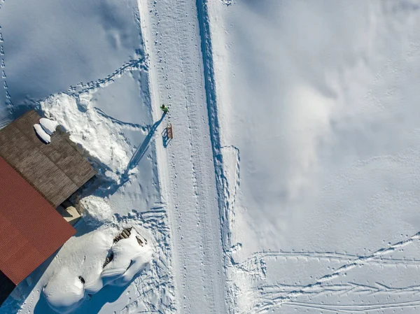 Aerial View Young Woman Pulling Sleigh Snow — 스톡 사진