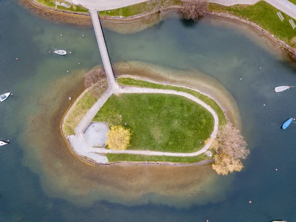 Aerial view of small island near coast on a lake in Switzerland