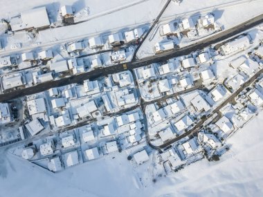 Aerial view of town with snow covered houses