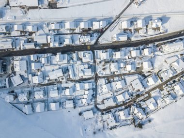 Aerial view of town with snow covered houses