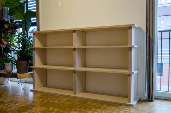 Empty bookshelf made of wood in flat at home