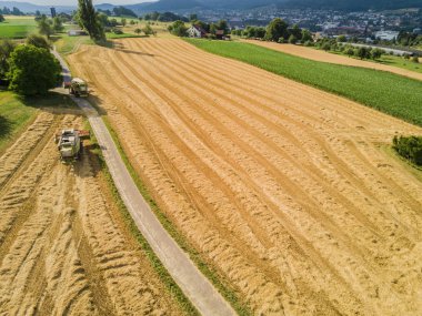 Aerial view of combine harvester on a field