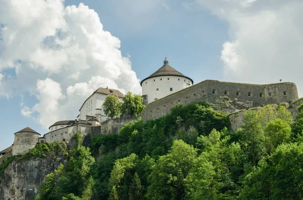 View of Kufstein castle above Inn river with dramatic clouds