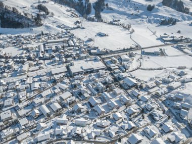 Aerial view of town with snow covered houses
