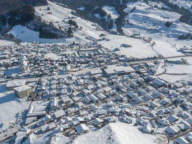 Aerial view of town with snow covered houses
