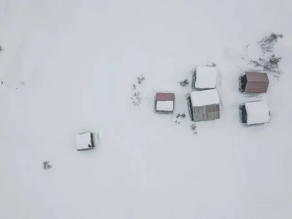 Aerial view of abandoned cottages in alpine area. Swiss mountain