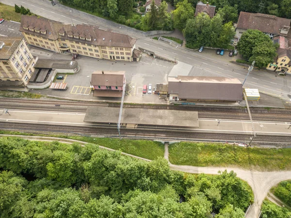 Aerial view of railway station in rural area in Switzerland