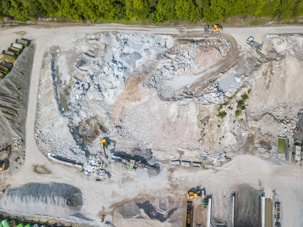 Aerial view of conveyor belt in open gravel quarry for raw material transportation