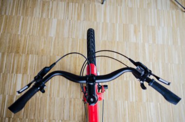 Close up of handlebar of bicycle in top view from above