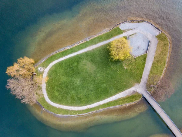 Aerial view of small island near coast on a lake in Switzerland