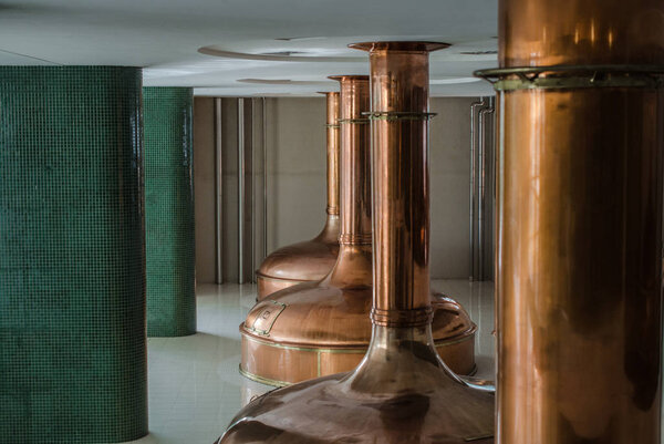 Copper kettles detail on background