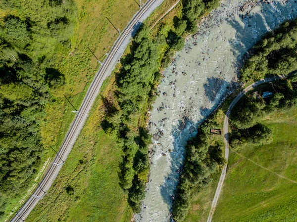 Aerial view of railroad tracks in alps in Switzerland