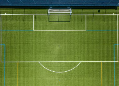 Aerial view of football goal and penalty area. Empty soccer field with white lines. clipart