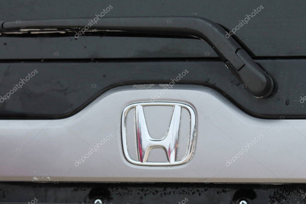 Honda car logo closeup on the grille close-up.