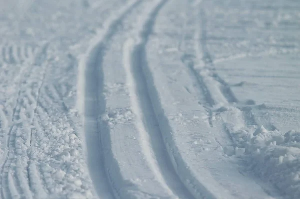 Ski track in snow , active winter holiday concept.