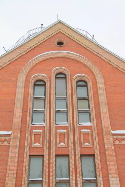 Fragment of a red brick church with windows — 스톡 사진