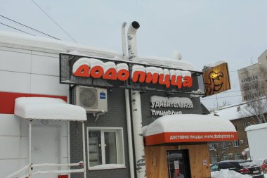 02.02.2020 Syktyvkar, Russia. Pizzeria Dodo pizza covered in snow in winter