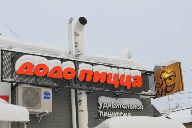 02.02.2020 Syktyvkar, Russia. Pizzeria Dodo pizza covered in snow in winter