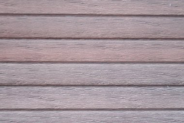 Dalgalı deseni ve çürükleri olan kırmızı ahşap bir doku. Metin için boş alanı olan doğal arkaplan. Web, baskı, arkaplan ve duvar kağıdı için stok fotoğrafı.