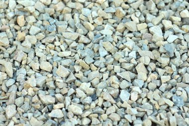 Background of blue and gray gravel. Small stones lie on the ground at a construction site. Pebble pattern on the beach clipart