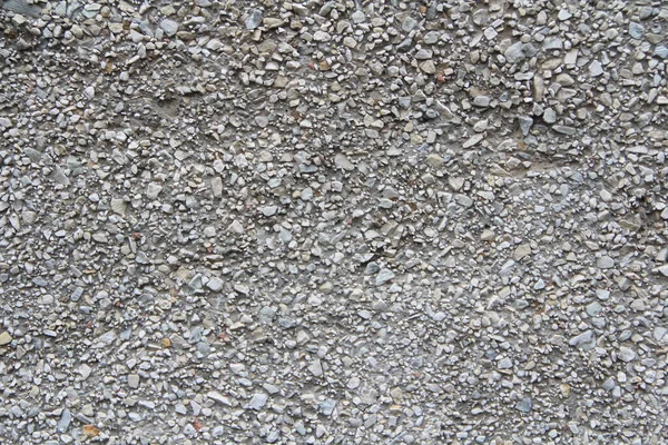 Асфальтовая влажная крошка, грубая грязная поверхность . — стоковое фото