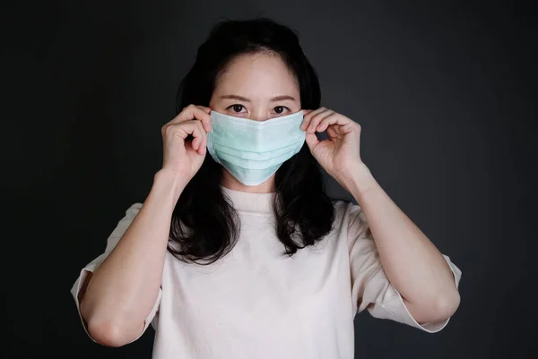 Girl with mask to protect her from virus or pollution