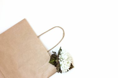 zero waste craft bag with flowers. eco friendly package concept. no plastic wrapping.