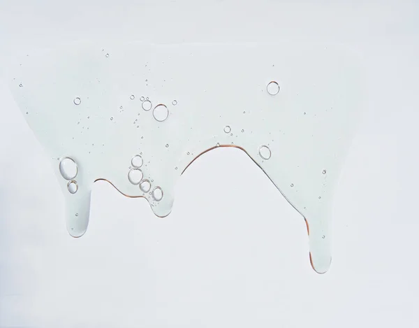 Коллаген пептиды сыворотка текстуры. Чистый косметический жидкий гель на белом фоне . — стоковое фото