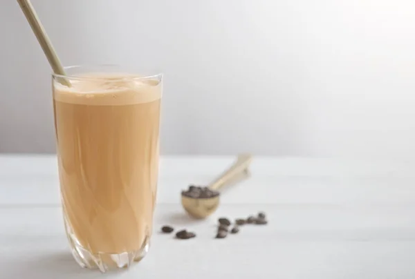 Cold coffee protein milkshake smoothie drink in a glass.