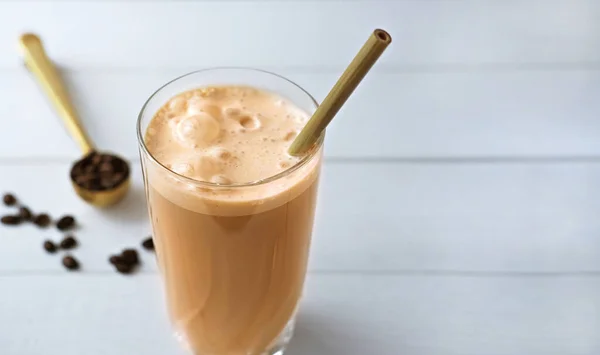 Cold coffee protein milkshake smoothie drink in a glass.