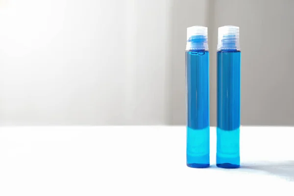 Blue Cosmetic Liquid Plastic Bottles Age Collagen Hyaluronic Acid Cosmetic — Stock Photo, Image