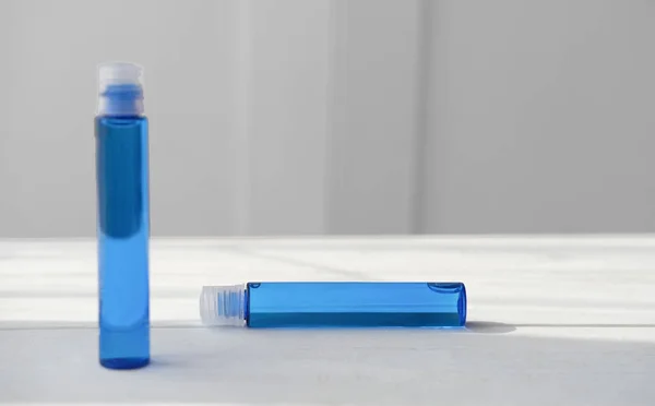 Blue cosmetic liquid in plastic bottles. — Stock Photo, Image