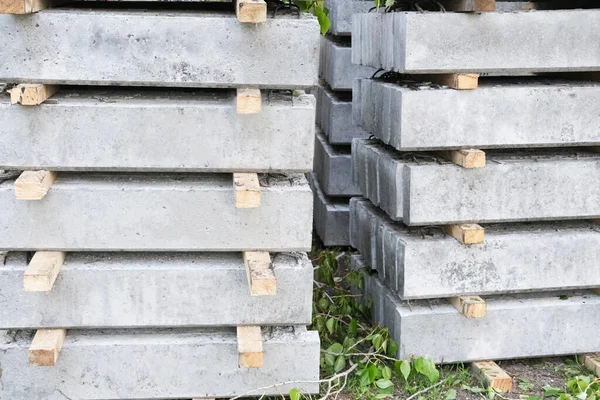 concrete plates in a stack. plates prepared to make a walkway. urban development and improvement of public places in city.